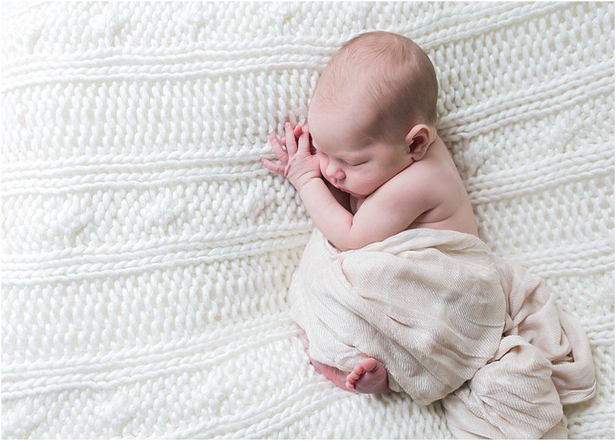 newborn baby simple natural pose on bed