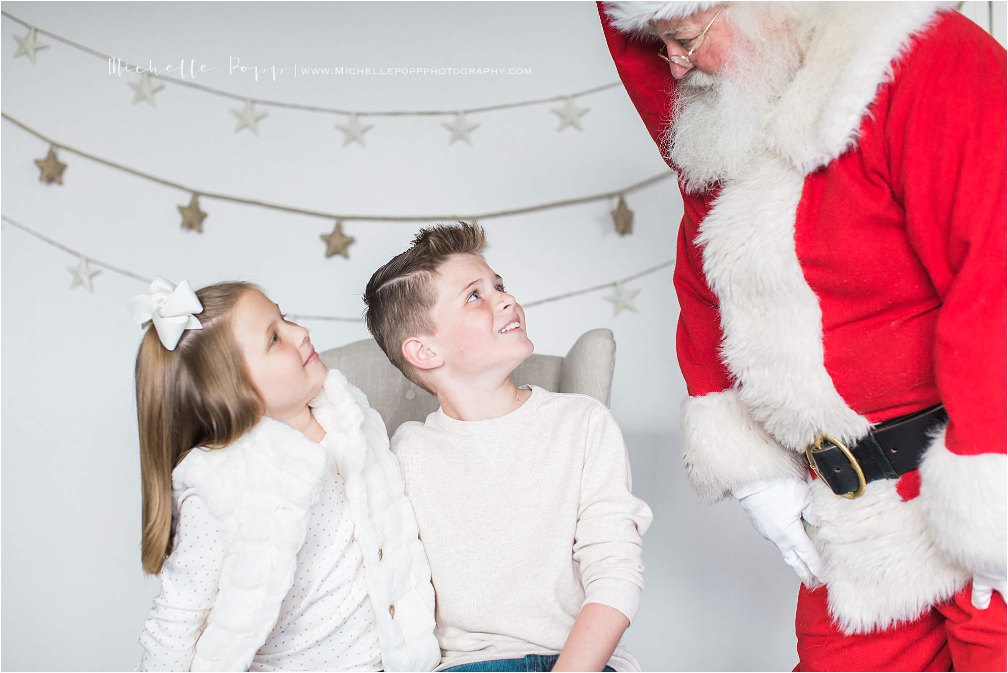 siblings surprised by Santa