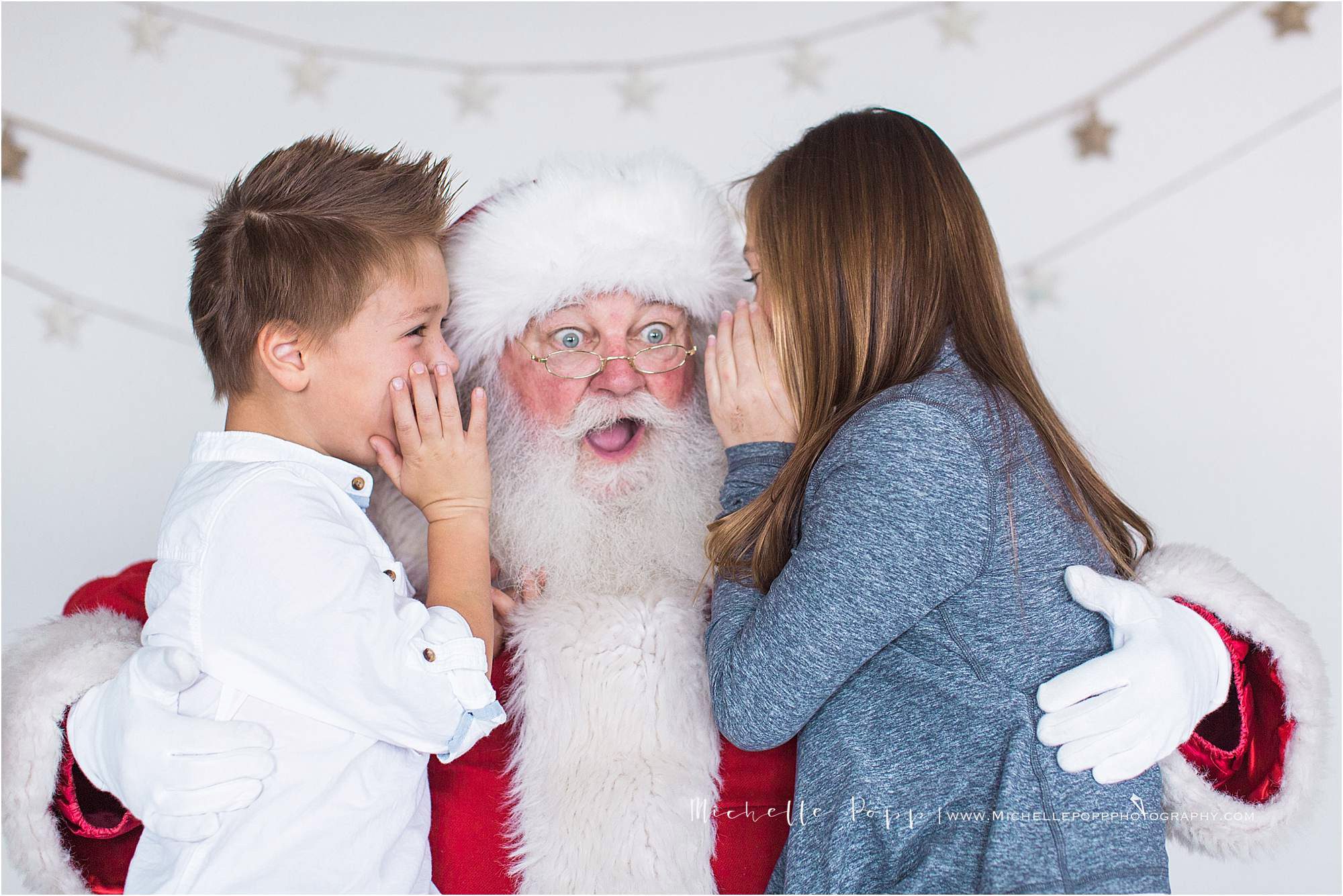 kids telling Santa a secret