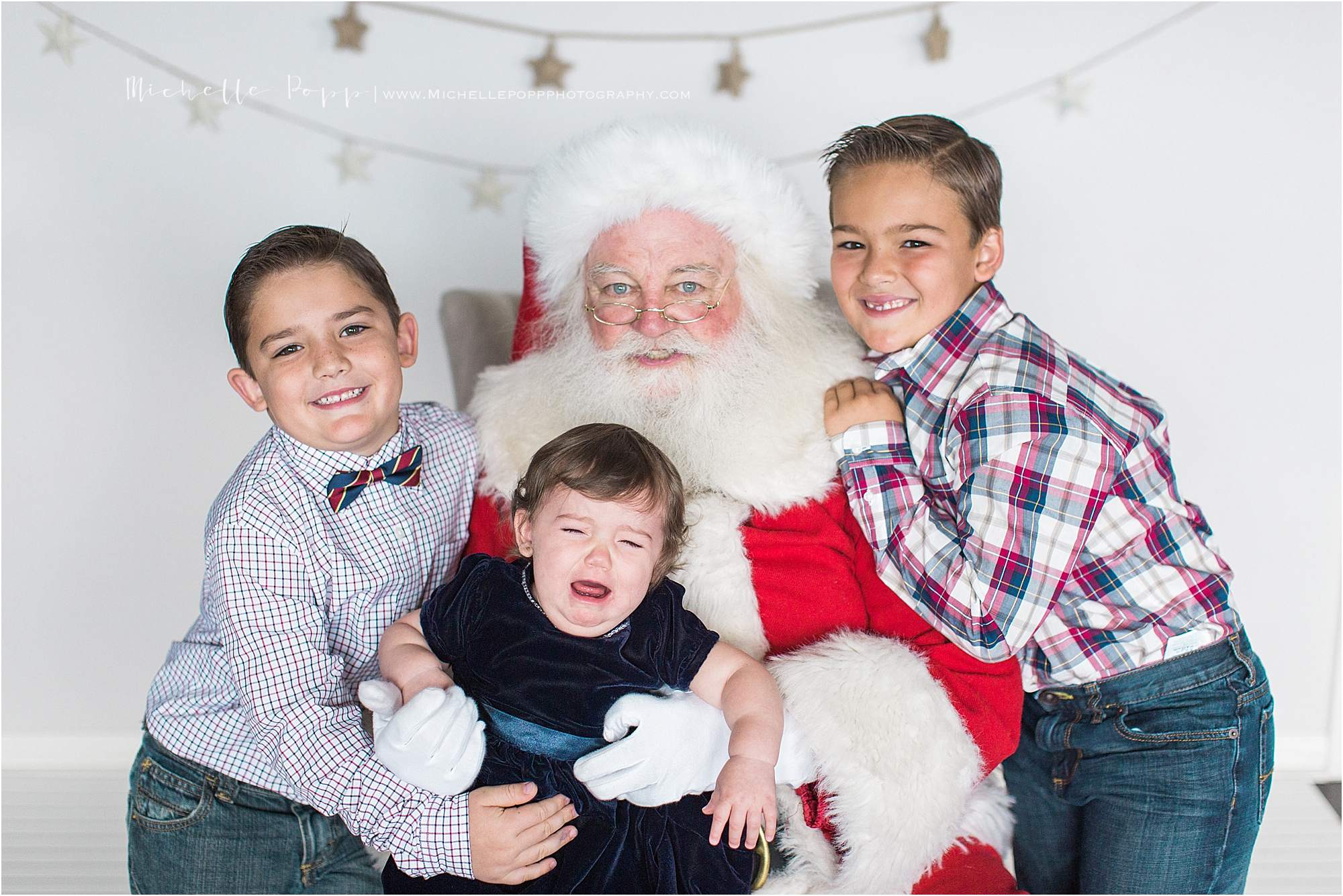 baby crying on Santa's lap