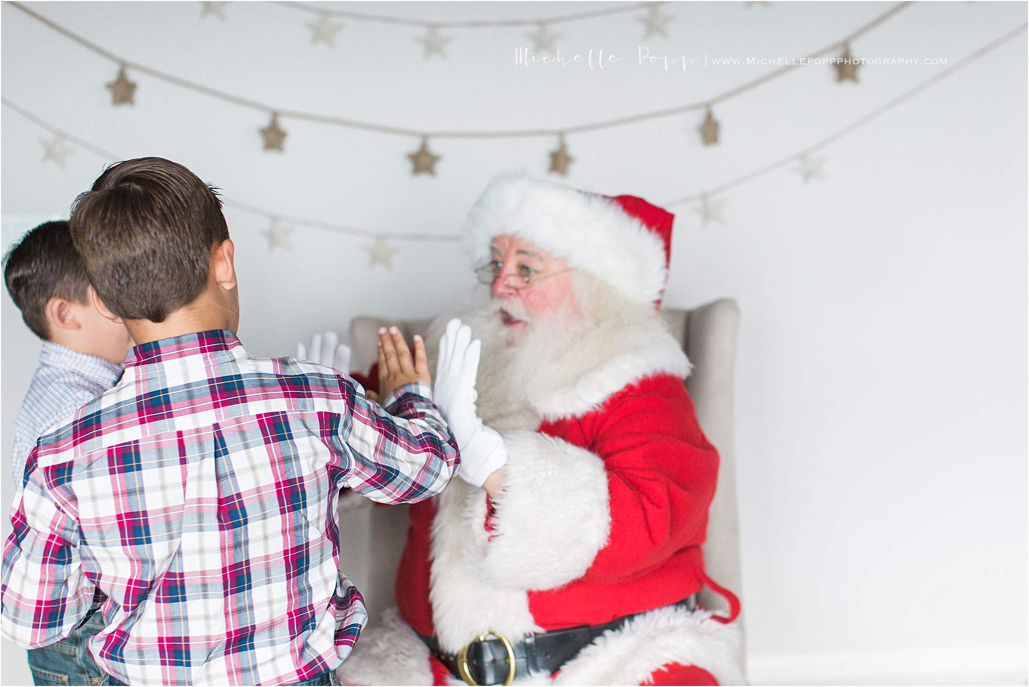 high fiving Santa