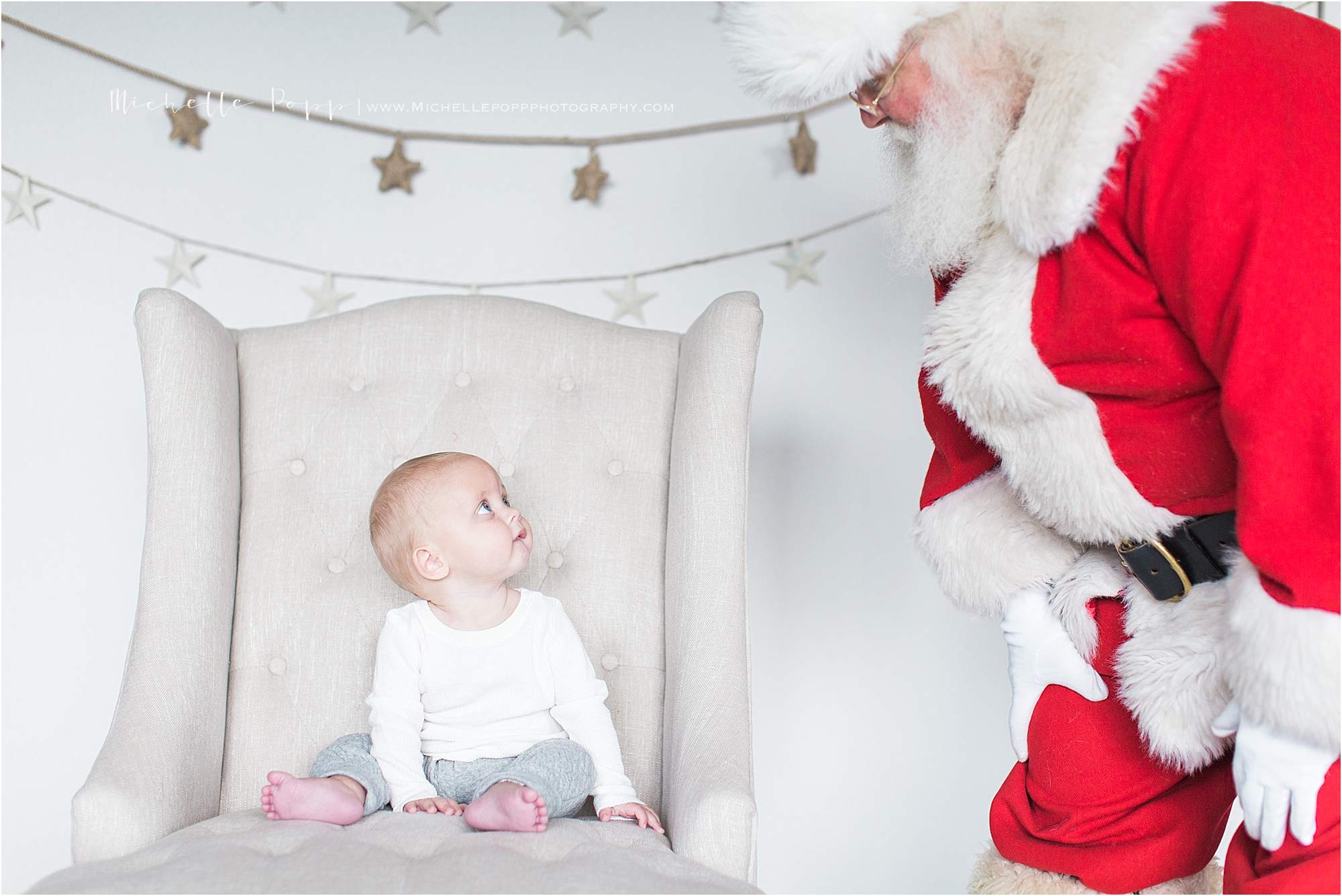 baby looking at Santa