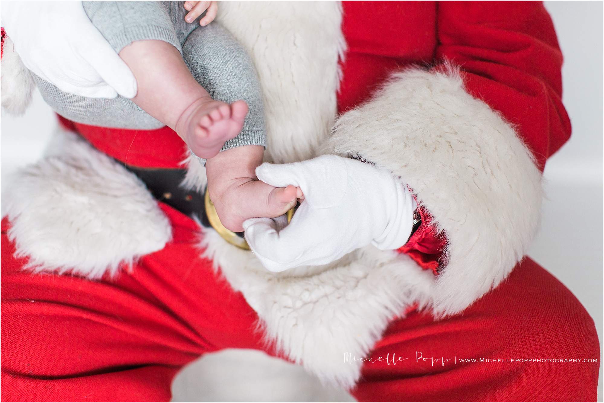 Santa touching babies toes