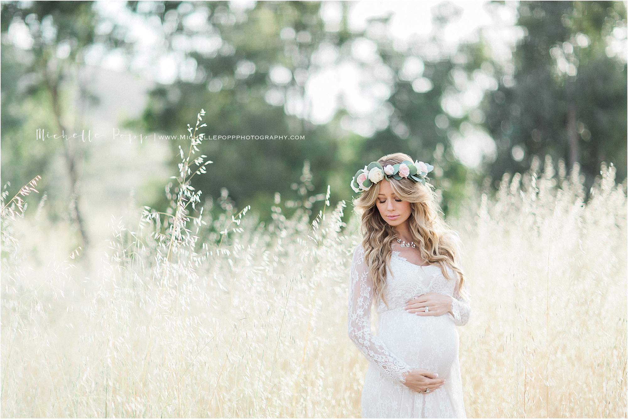 mom with floral crown looking at belly