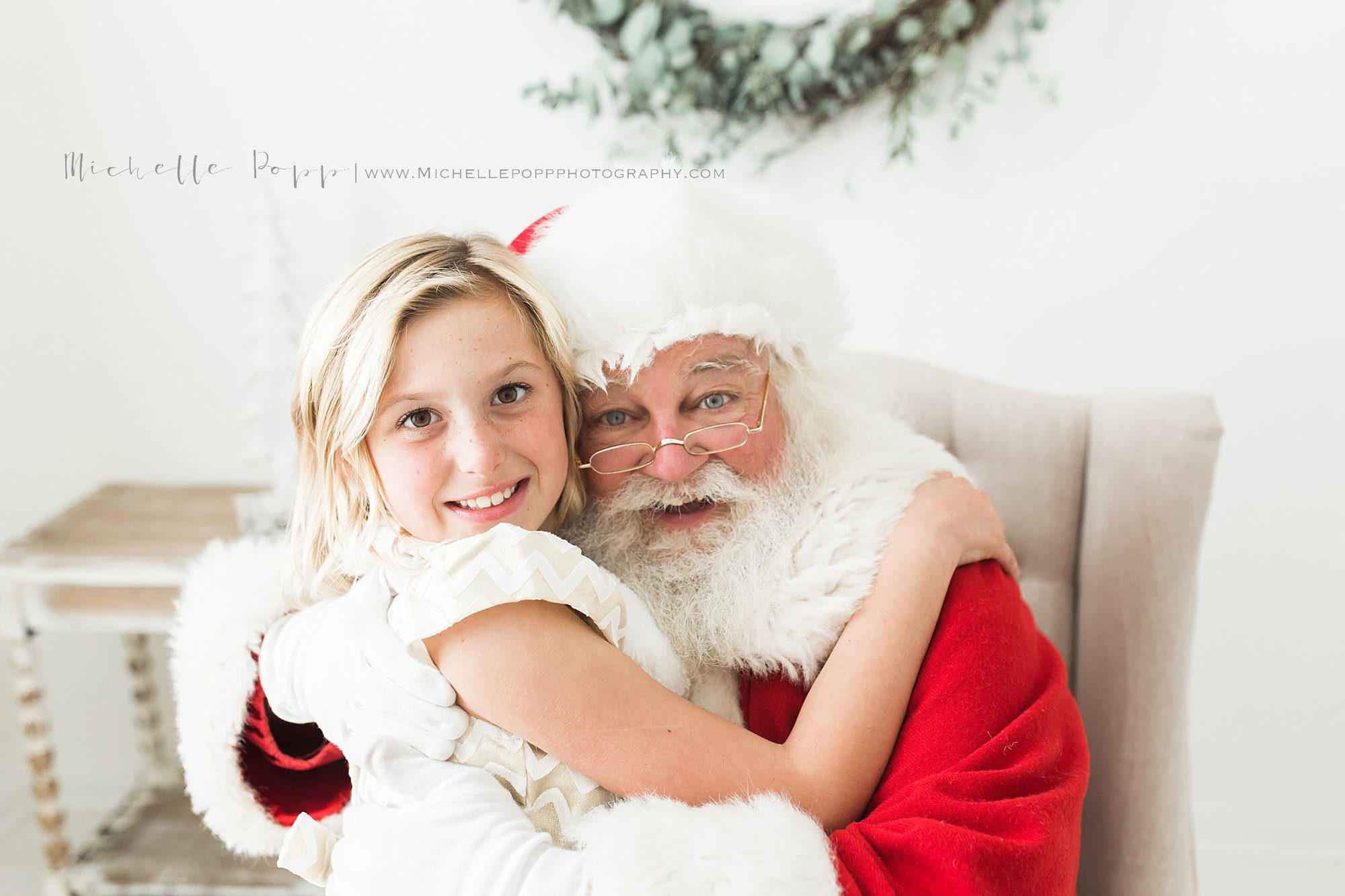 one of the best Santa photos in San Diego of a little girl with Santa