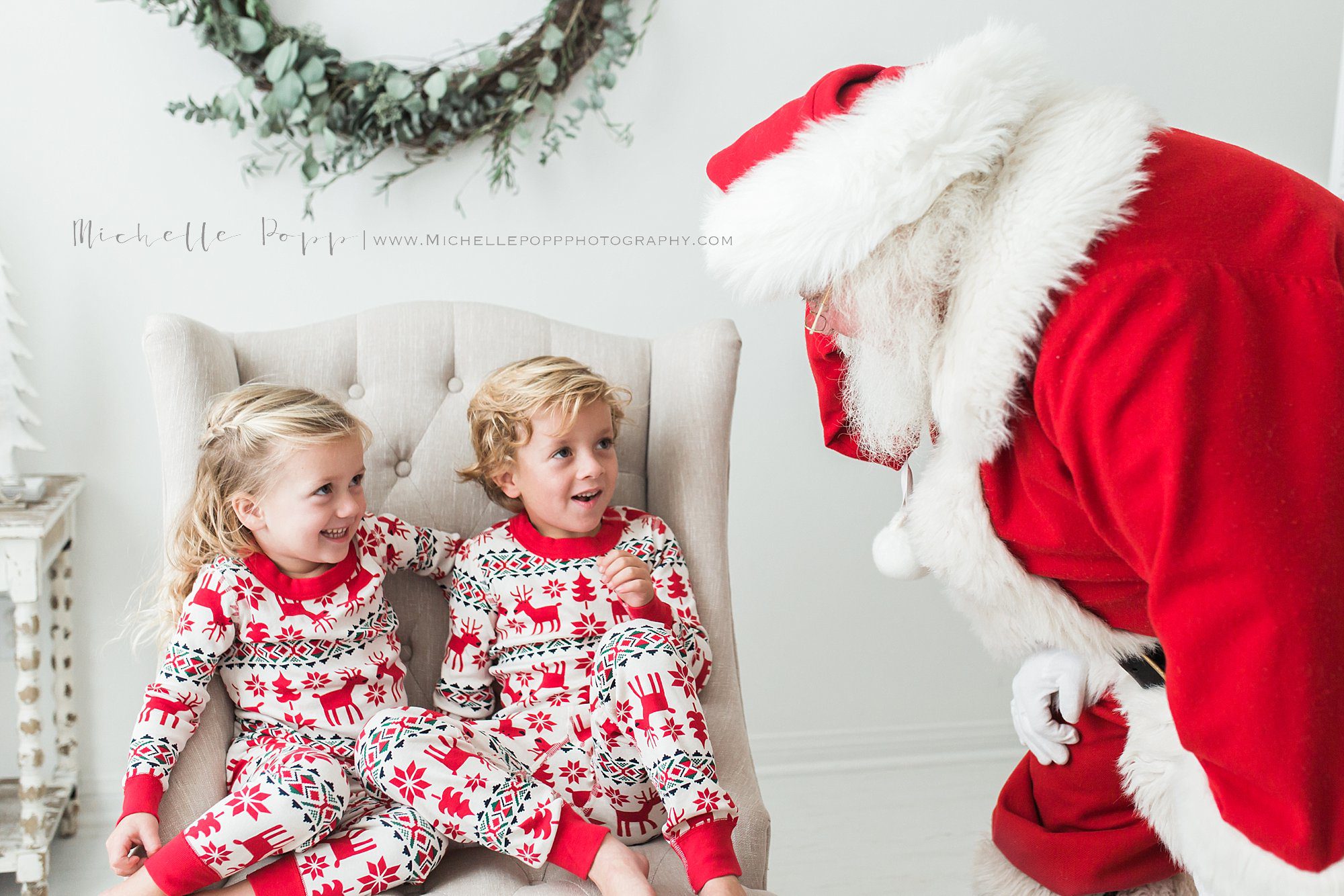 little boy & girl excited to see Santa