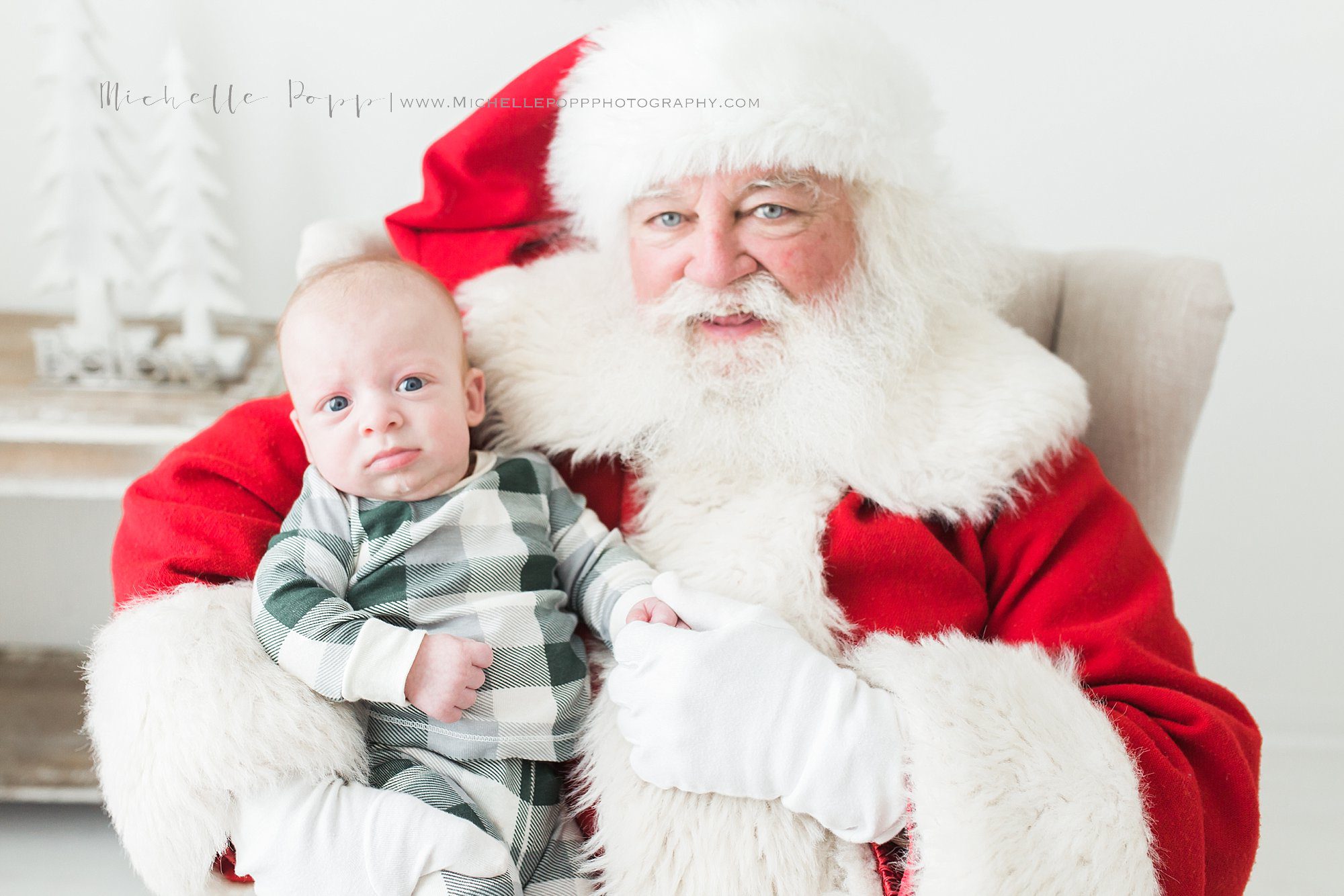 baby sitting on Santa's lap