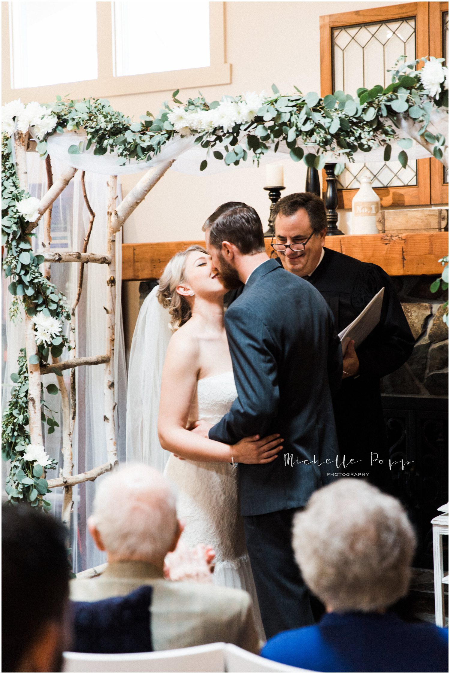 the bride and grooms first kiss