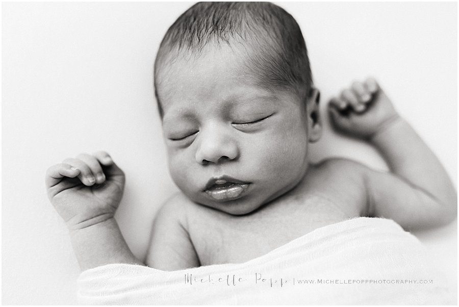 newborn baby sleeps during a newborn photo shoot