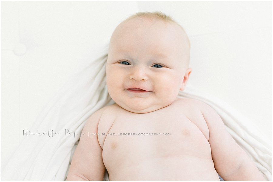 close up image of a smiling baby boy
