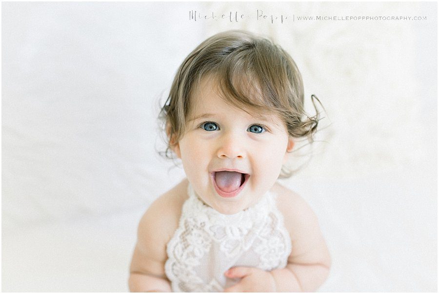 a happy baby during a natural baby photography session in San Diego