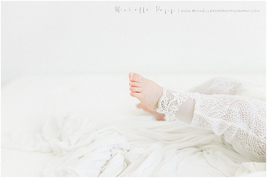 a picture of a baby's feet taken during a natural baby photography session