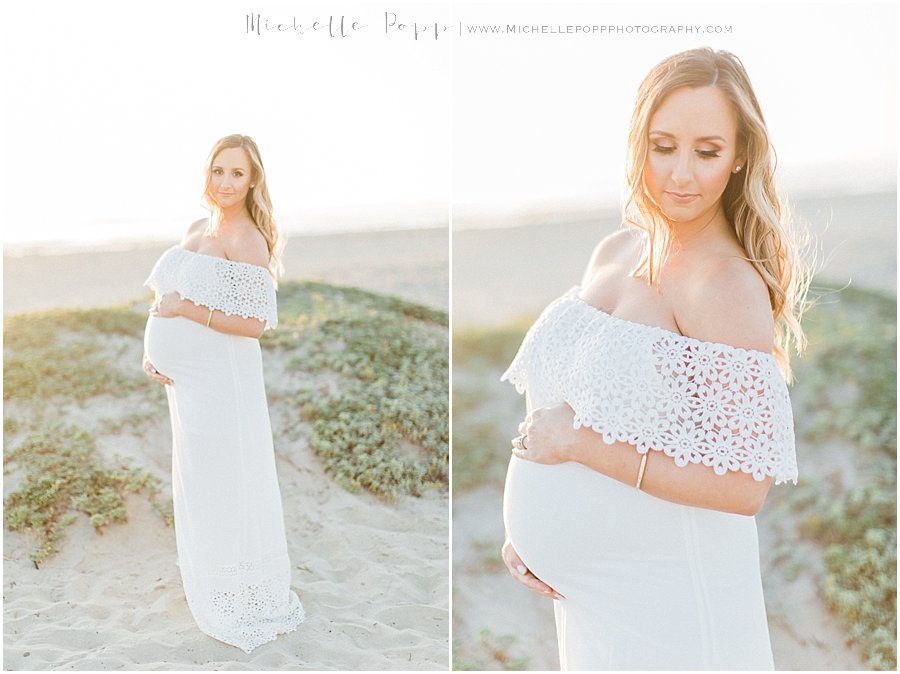 pictures of a mother holding her baby bump during a beach maternity photography session in Carlsbad