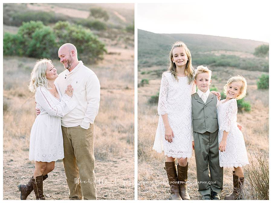 mom and dad and children in field smiling at camera