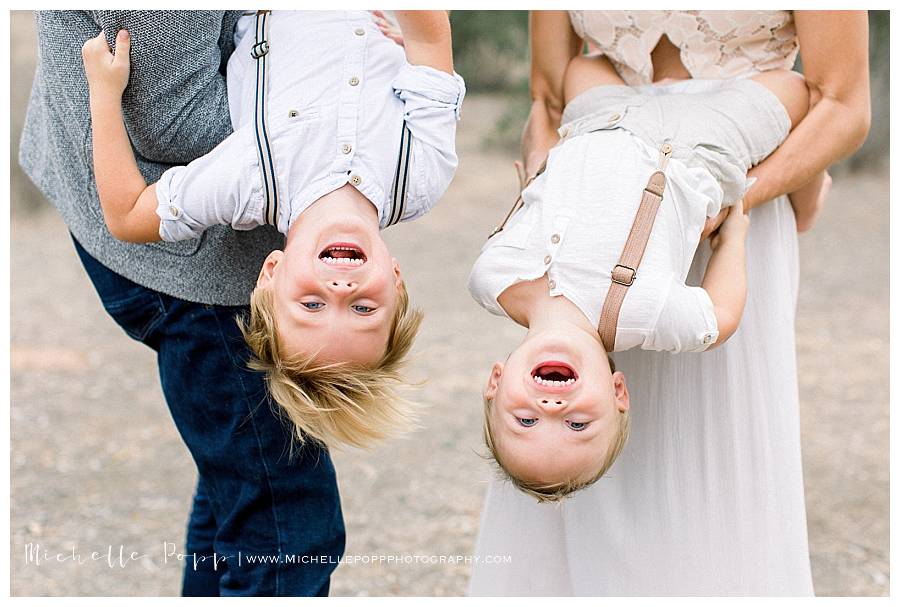 two boys laughing upside down