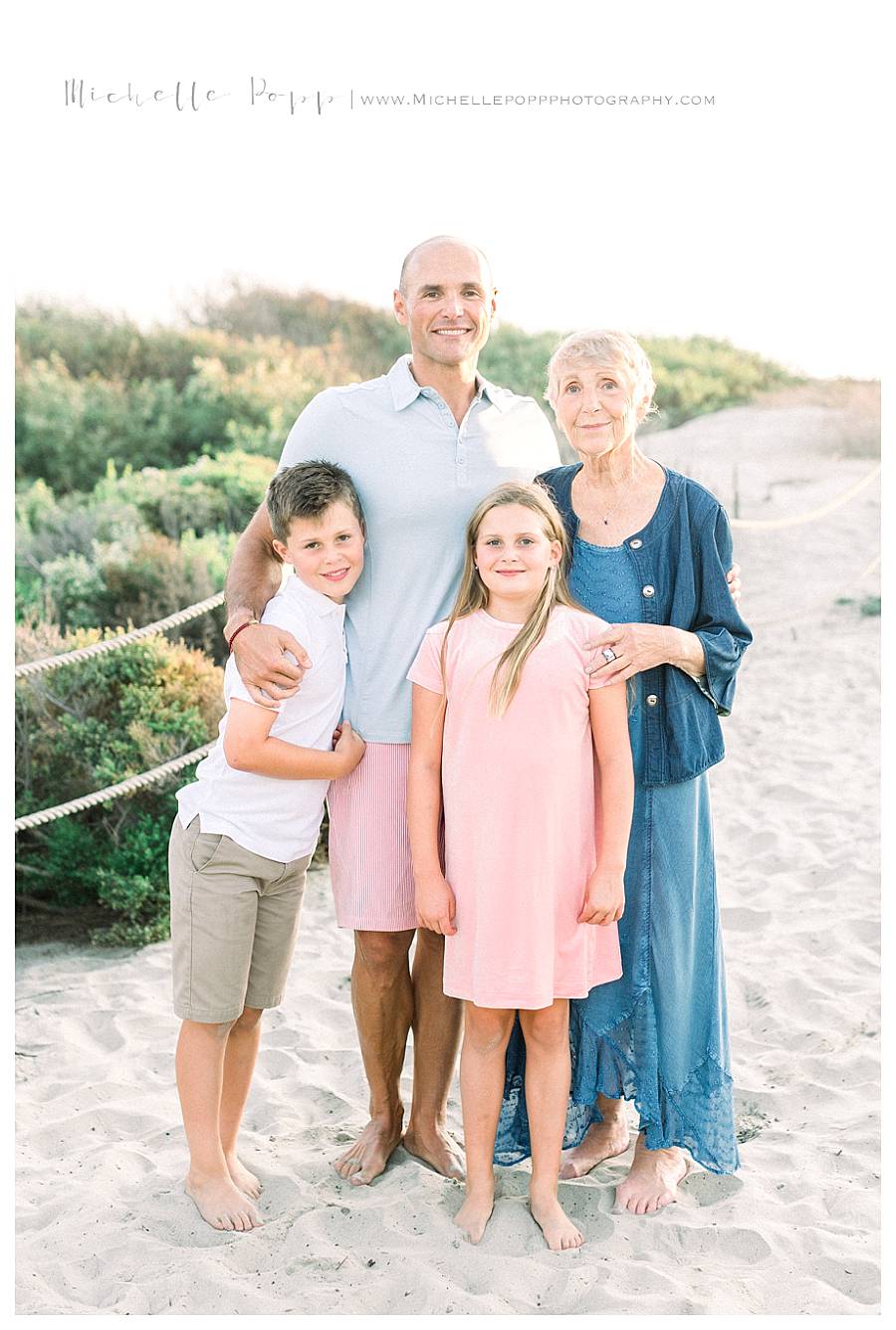 family of four smiling at camera