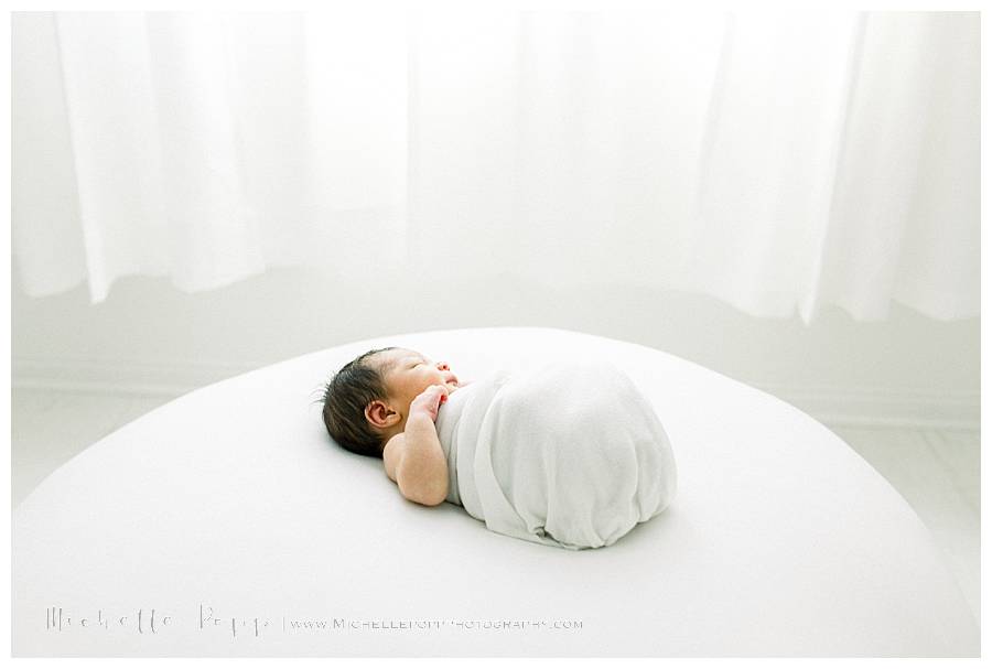 newborn baby boy on white pillow
