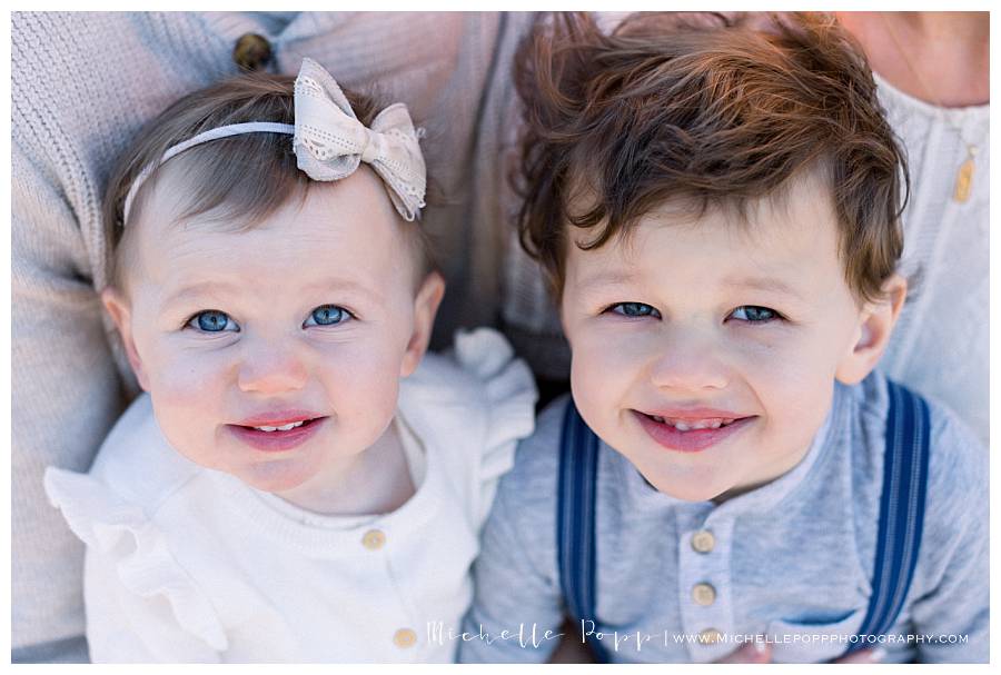 close up of two kids faces smiling