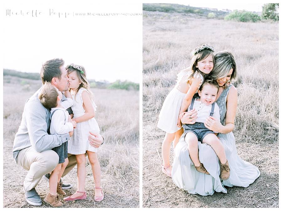 family in a group hug in field