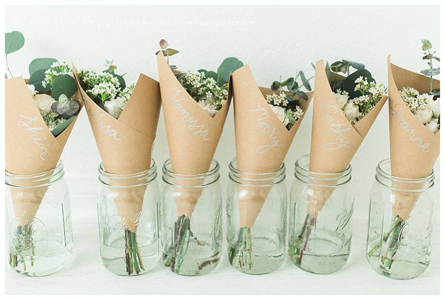 flowers wrapped in brown paper in vases