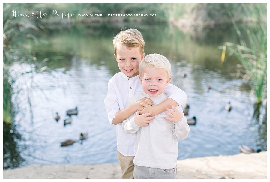 toddler boys hugging each other