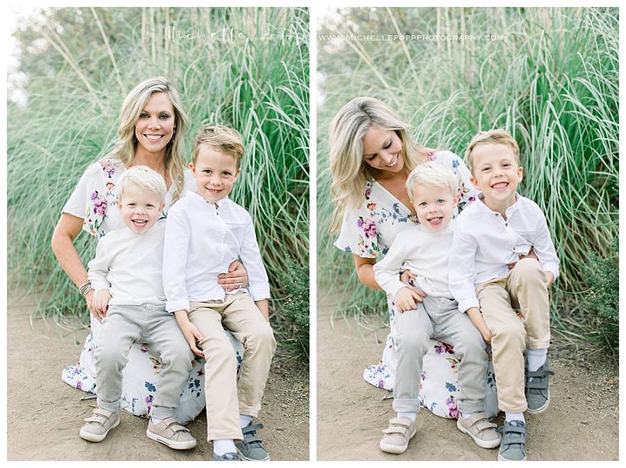 mom holding two toddler boys