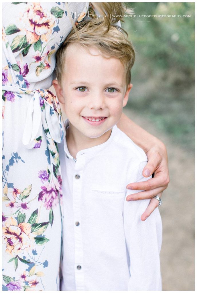 toddler boy smiling at camera close up