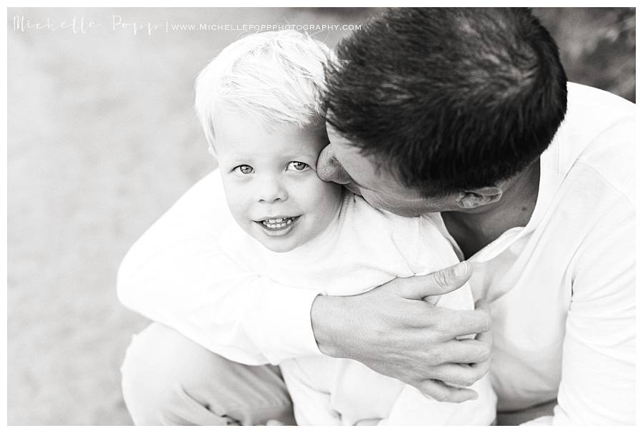 black and white of boy with dad