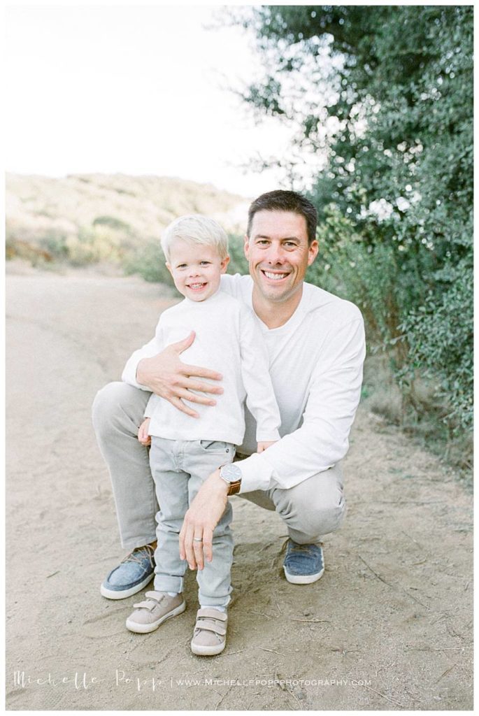 boy with dad in a field