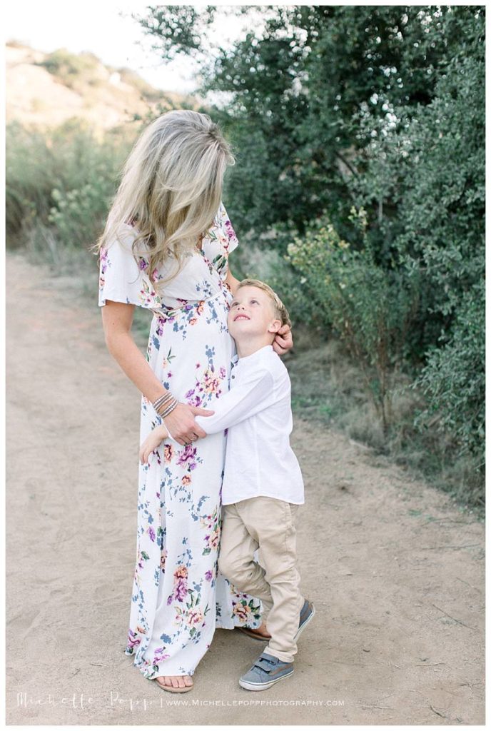 mom and son looking at each other and smiling