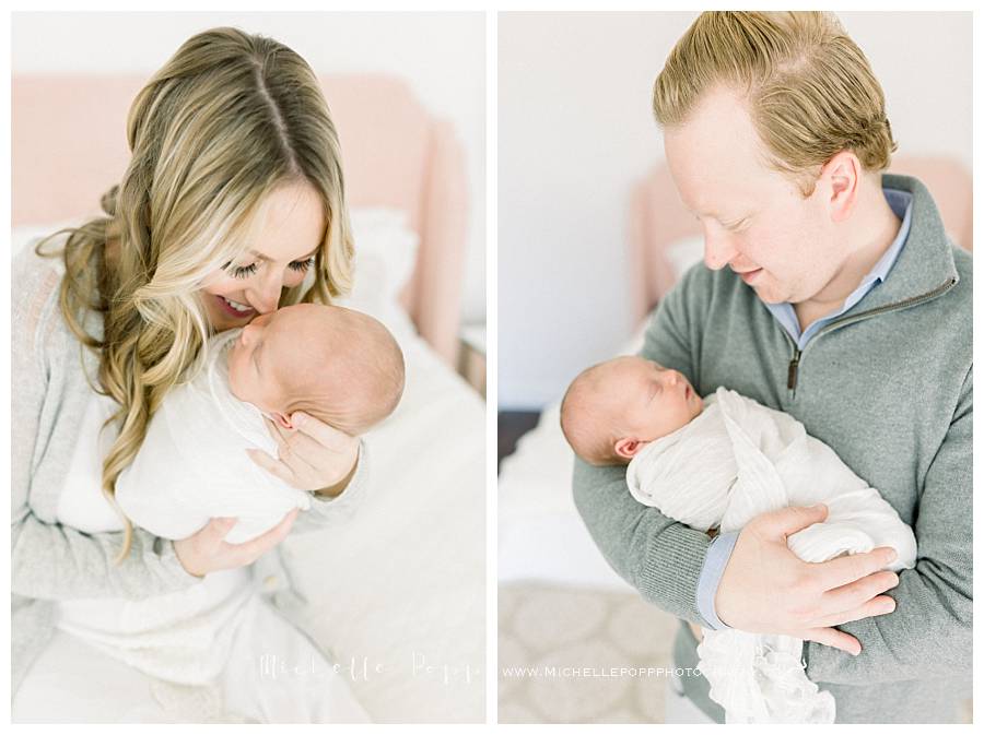 mom and dad holding newborn baby girl