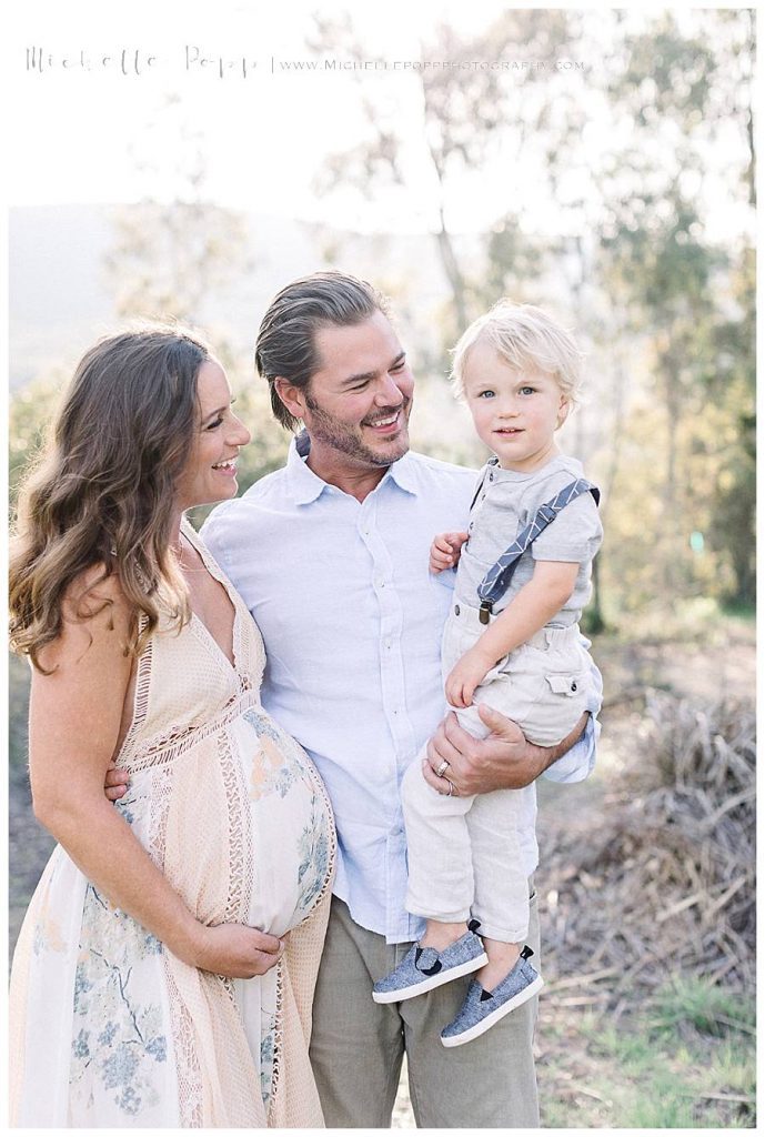 parents smiling at son