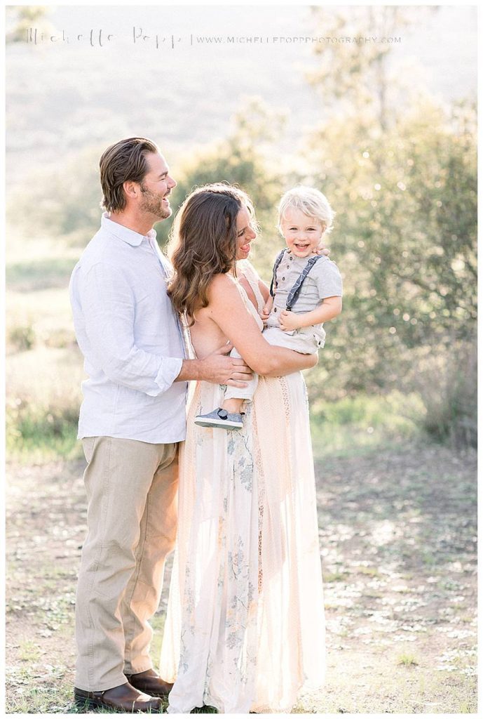 smiling at son in field