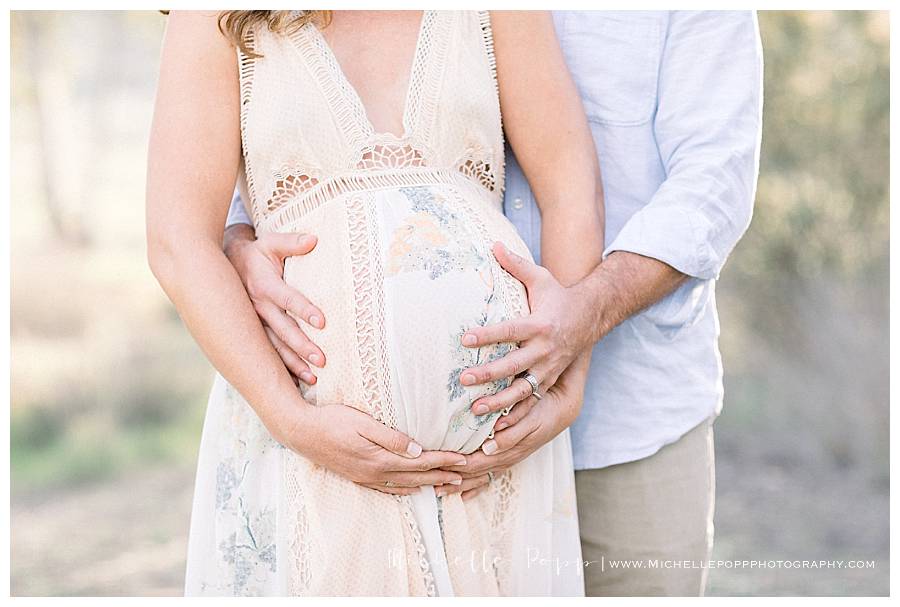 holding baby belly