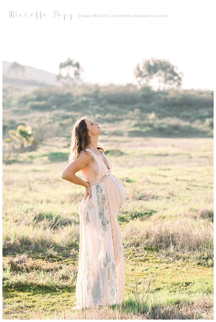 mom in field with baby bump