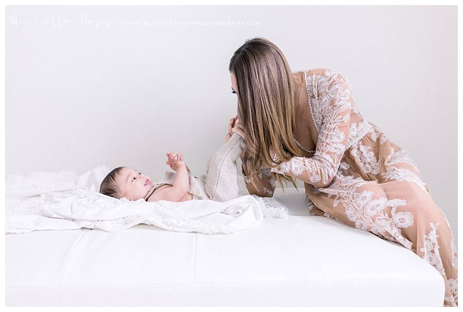 mom kissing baby's feet