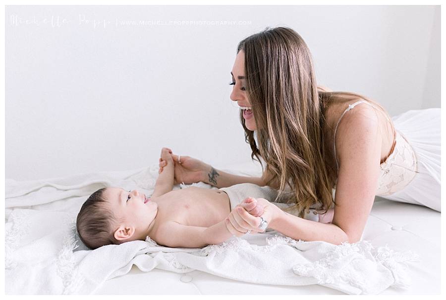 mom smiling at baby boy