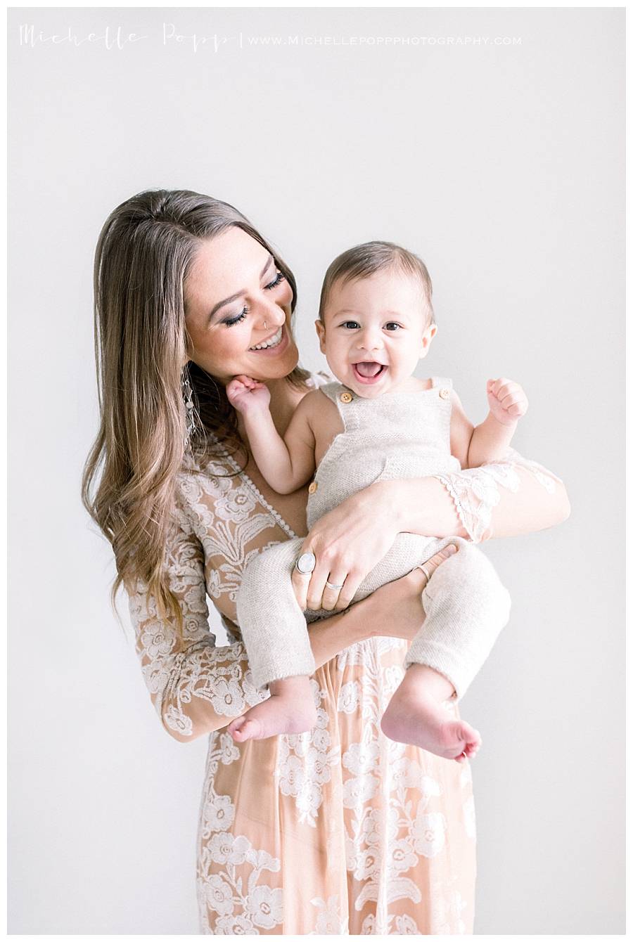 mom smiling at baby boy 