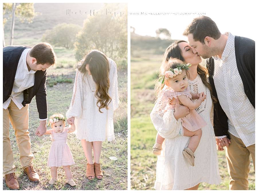 mom and dad holding daughter's hands