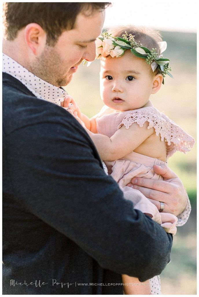 dad snuggling daughter