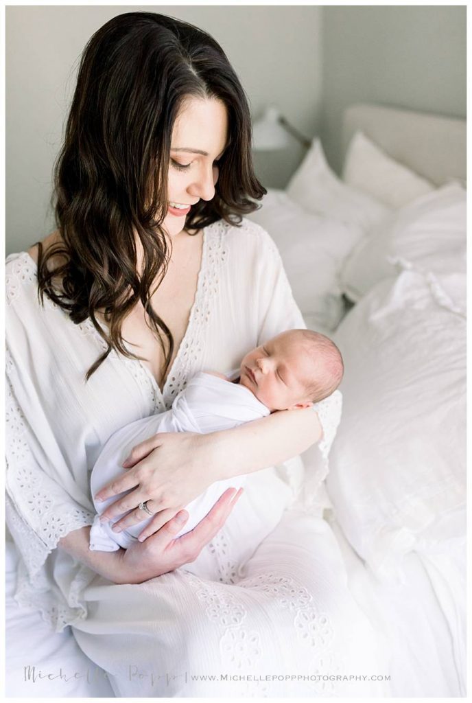 mom holding newborn baby boy