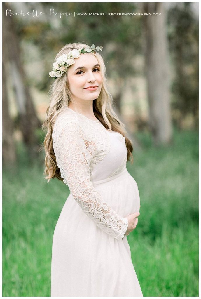 pregnant mother in a green field