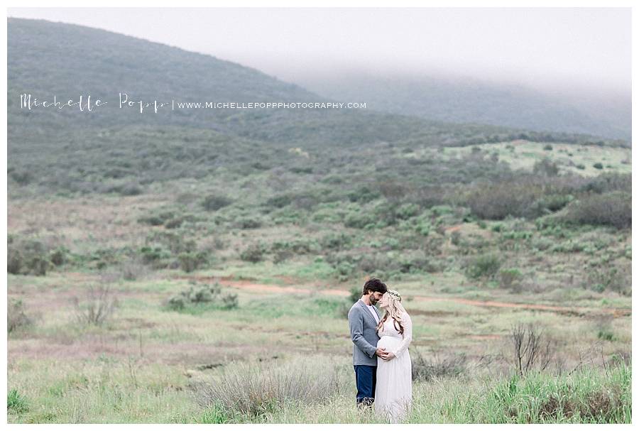 couple in a field at dawn