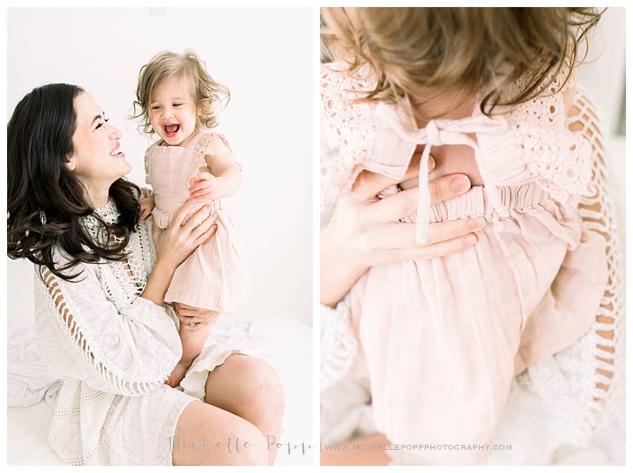 mom and daughter laughing on bed