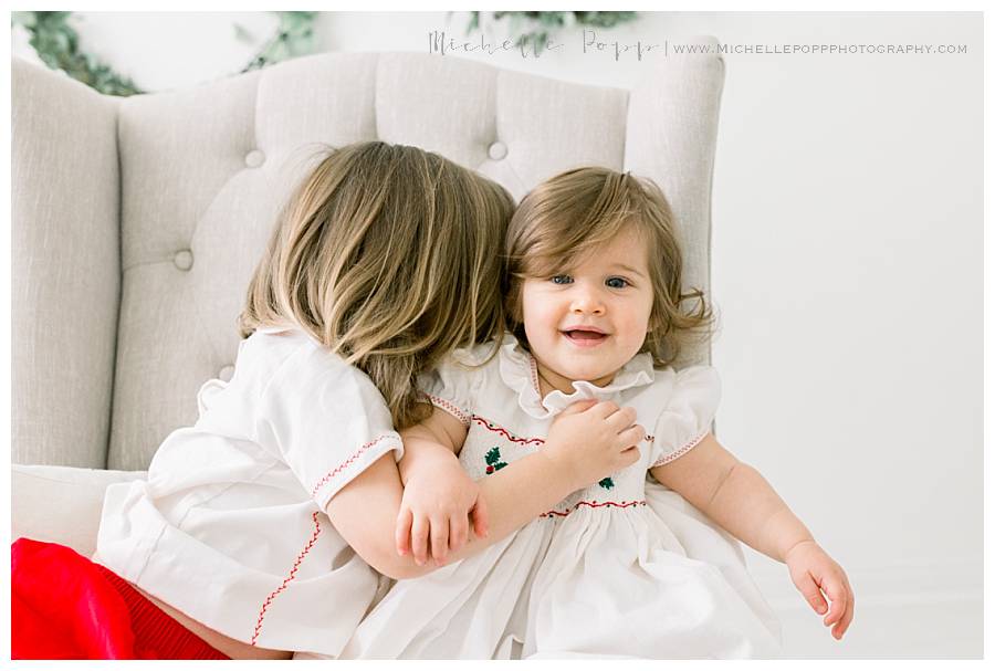 boy and girl sitting on chair