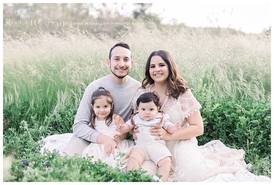 family of 4 in a field