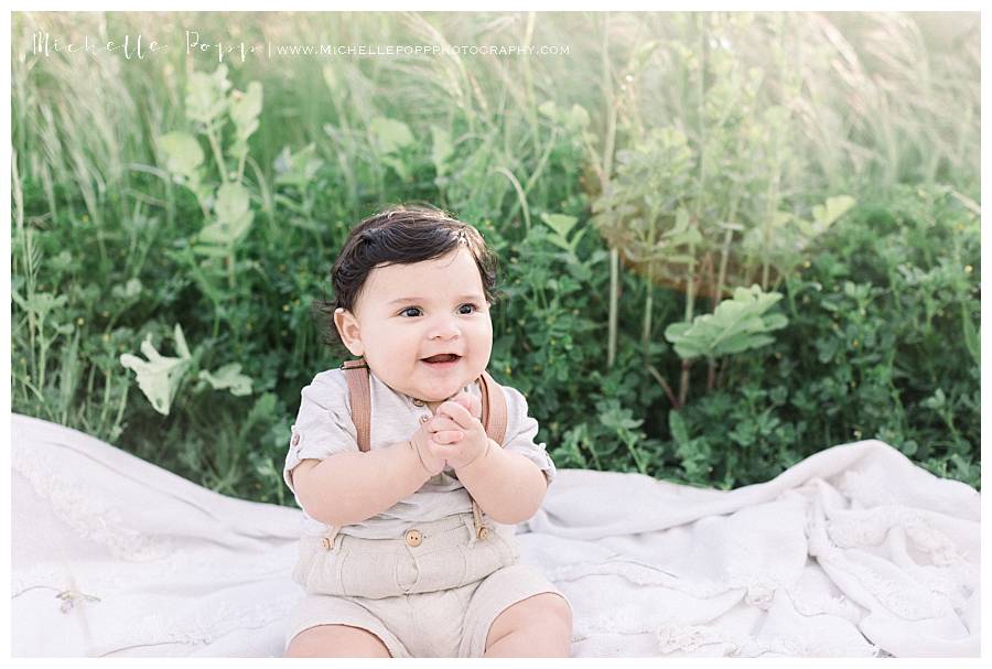 baby boy sitting on blanket