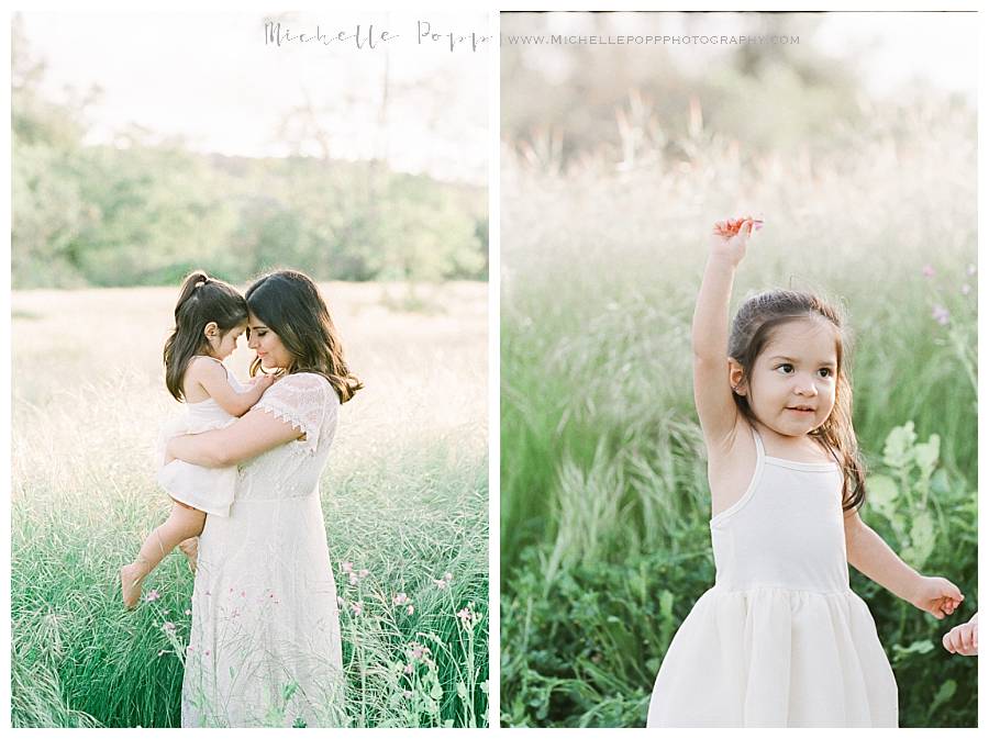 little girl in a field with mom