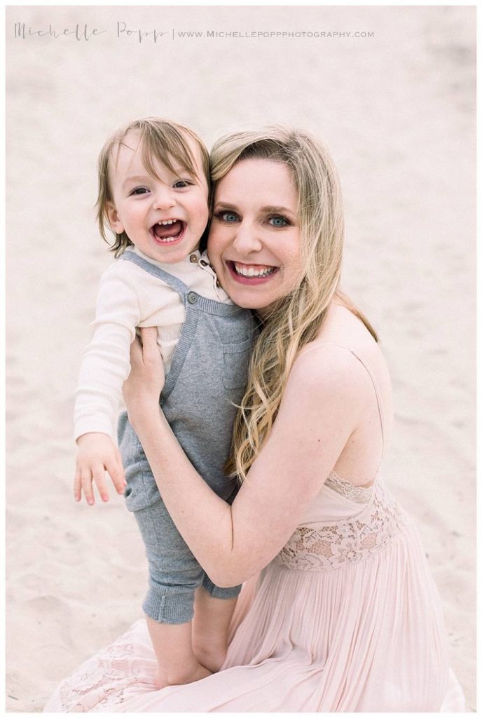 baby boy and mom laughing