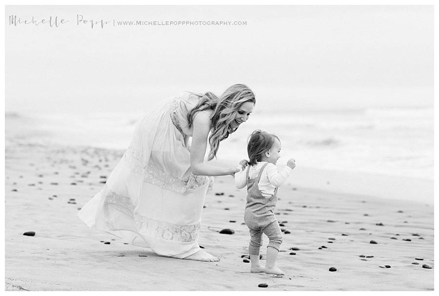 mom and baby boy on the beach